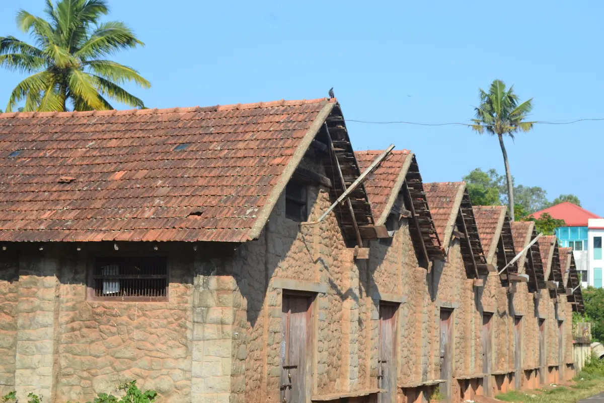 Old brick warehouses with tiled gabled roofs near the lighthouse in Alappuzha